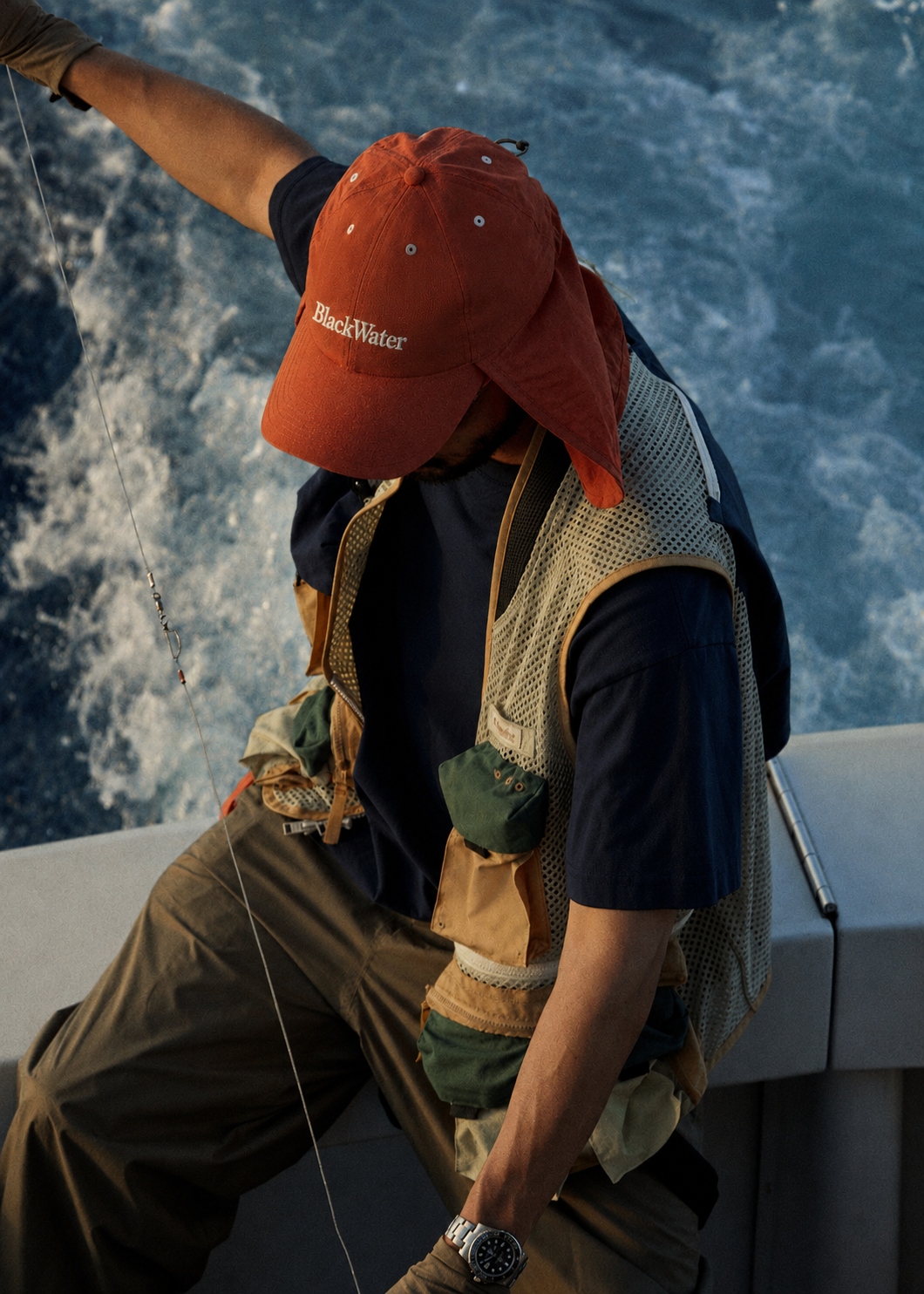 Water — orange cap on fishing boat