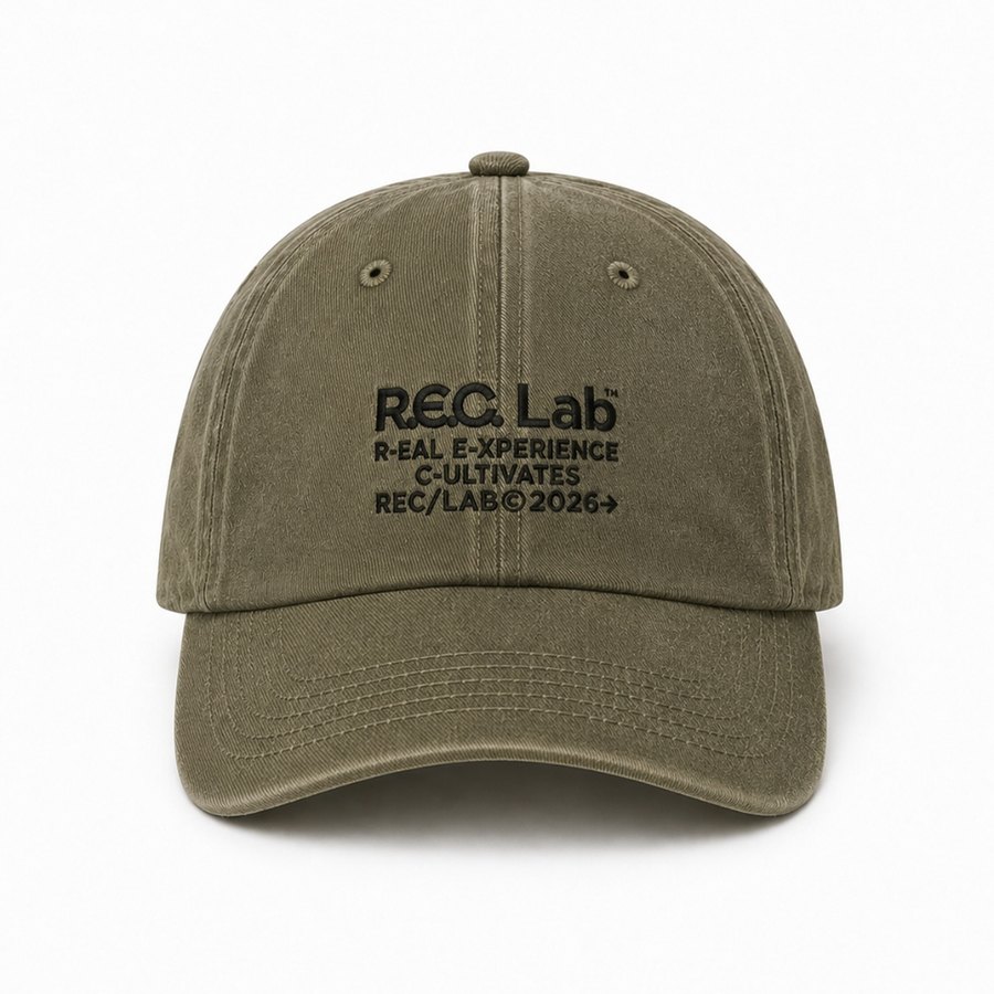 Direct embroidery on cream cap with red varsity lettering