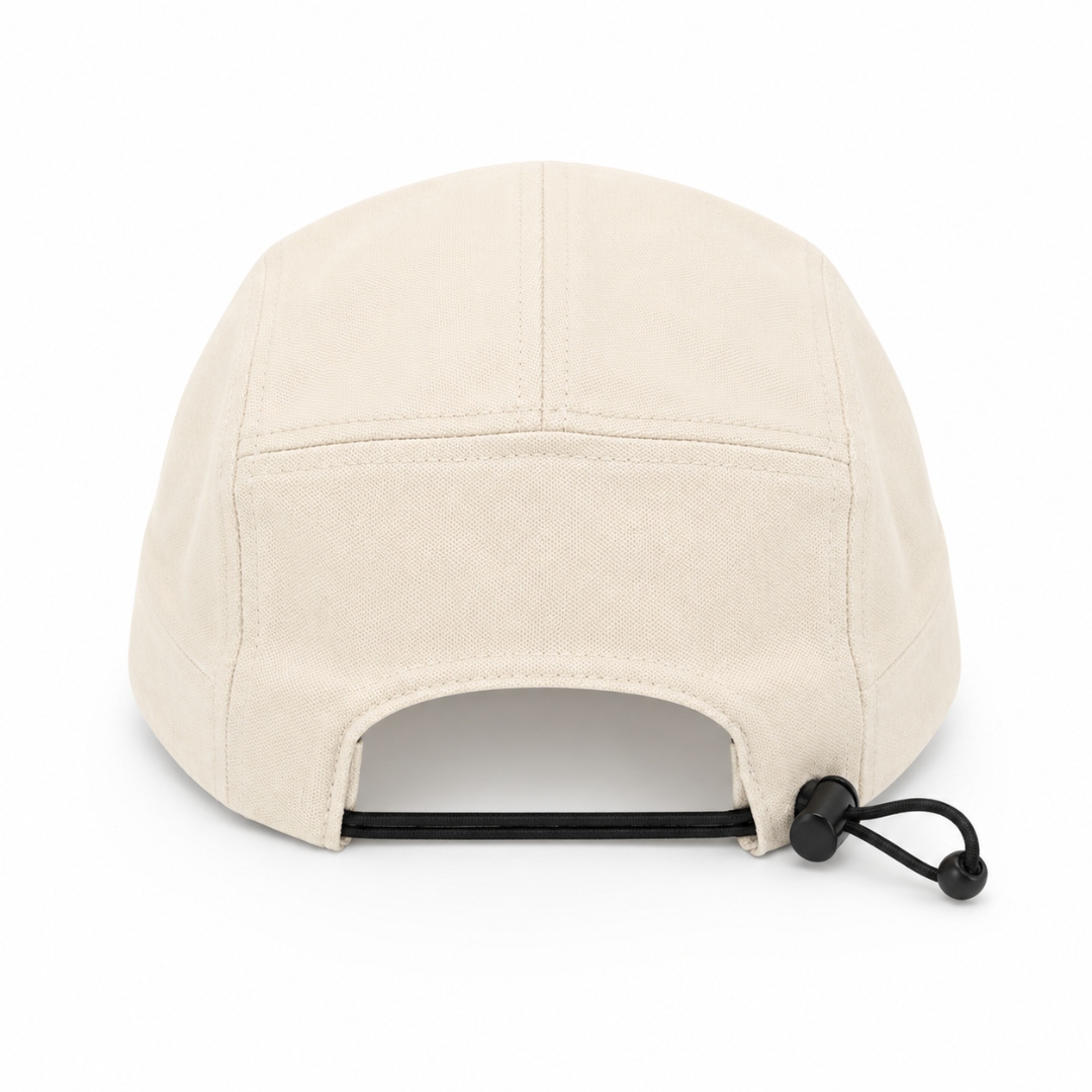 Bungee cord with toggle closure on back of five-panel canvas cap